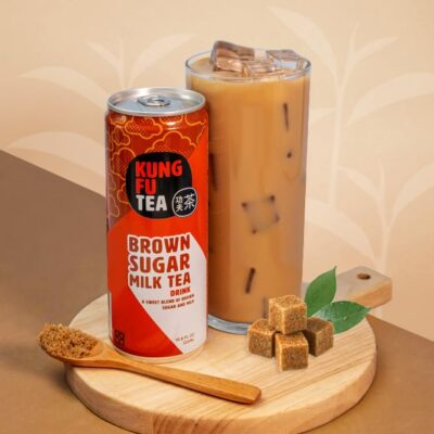 kft brown sugar milk tea drink on a table with a spoon